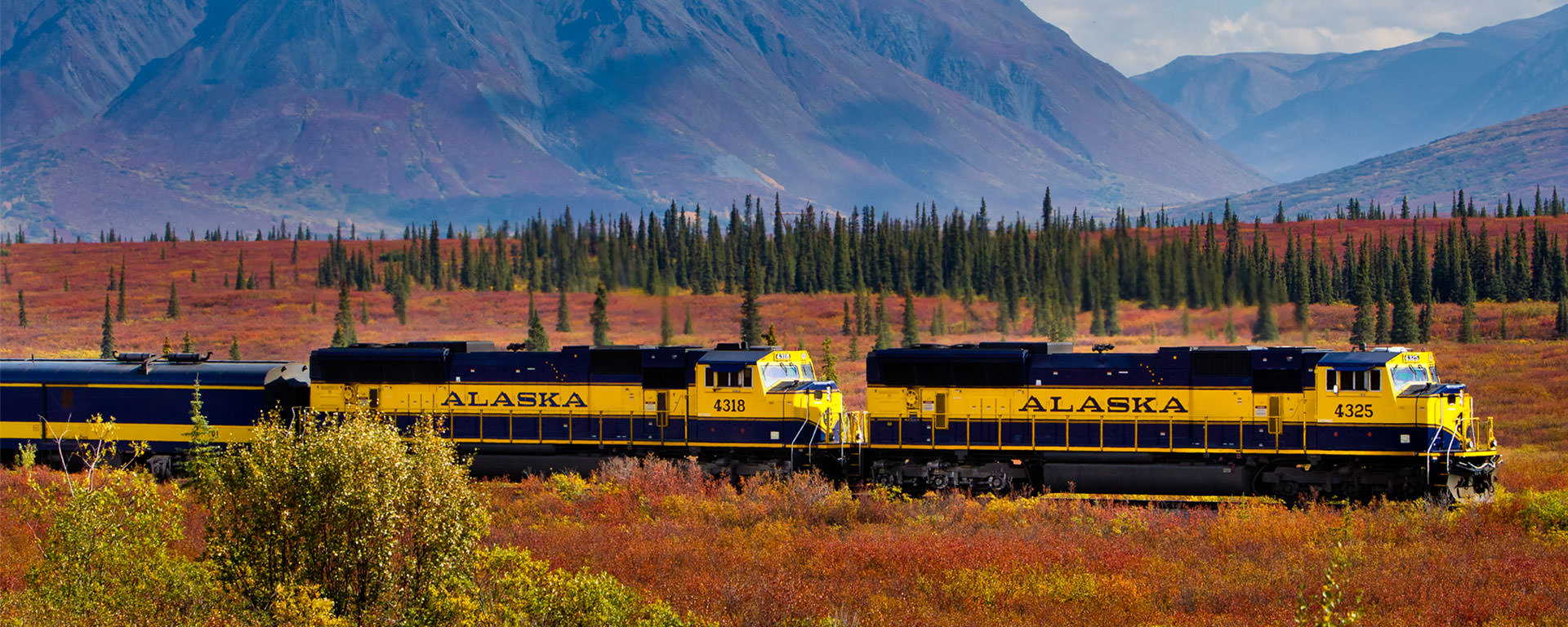Alaska Railroad Denali Star traveling through wilderness scenery