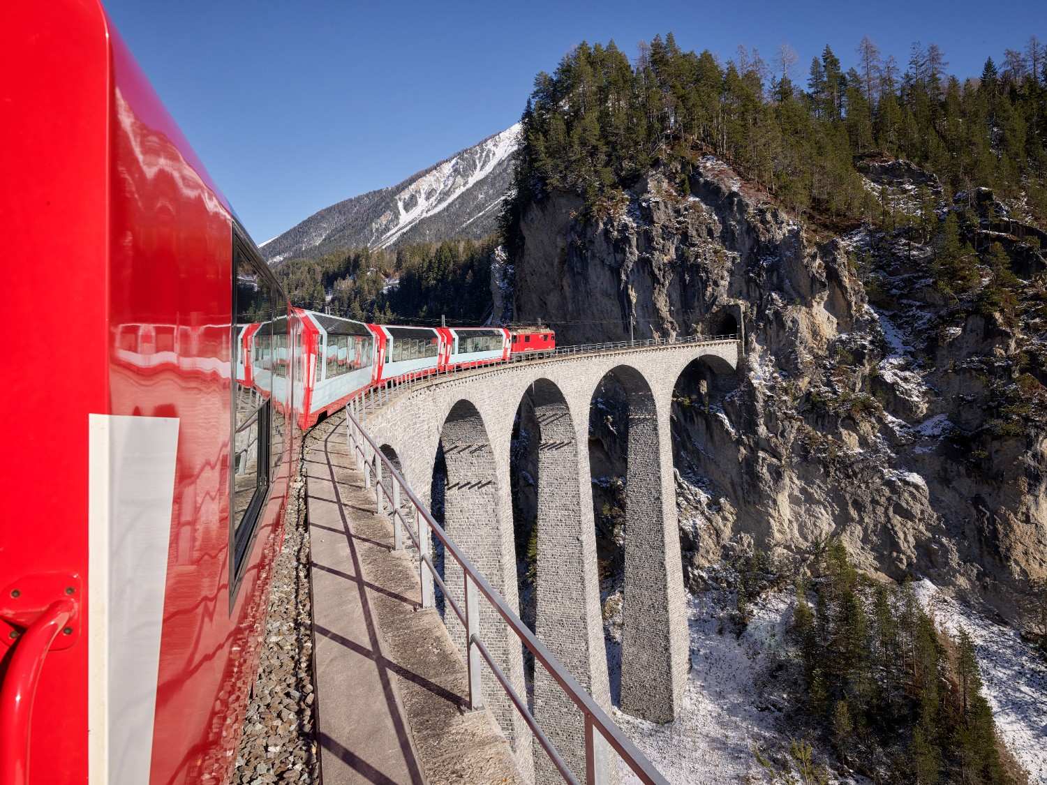 Glacier Express panoramic train crossing the Swiss Alps